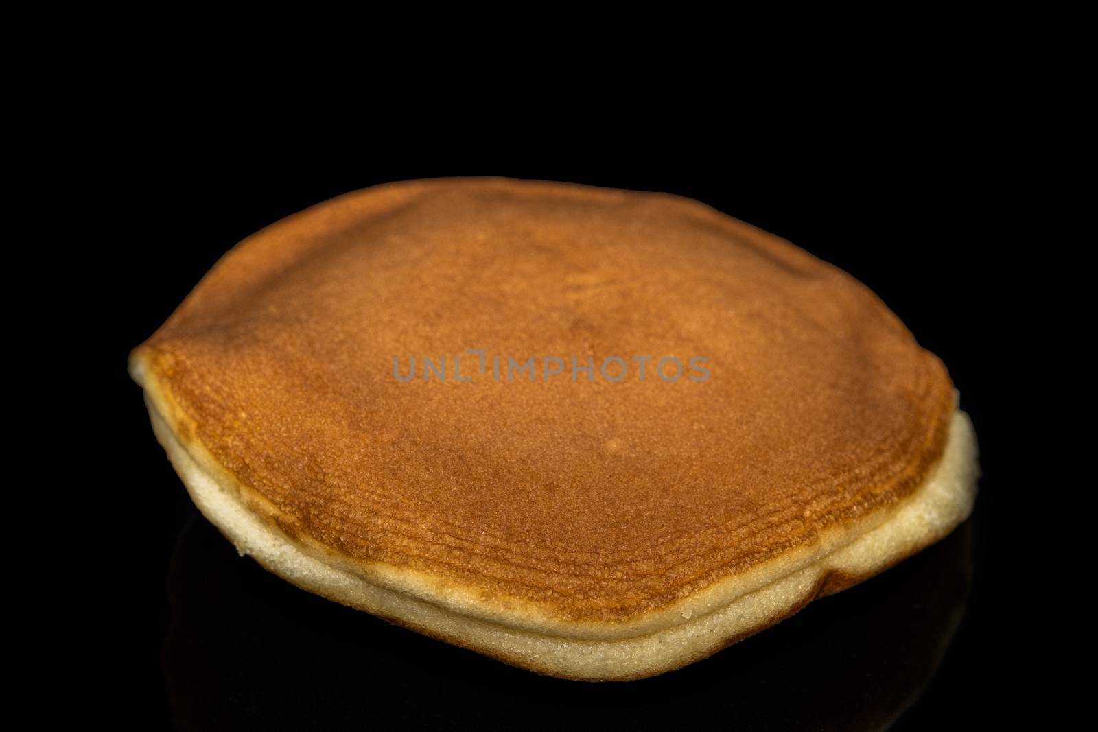 Dorayaki , Japanese traditional red-bean pancake dessert isolate on black background by peerapixs