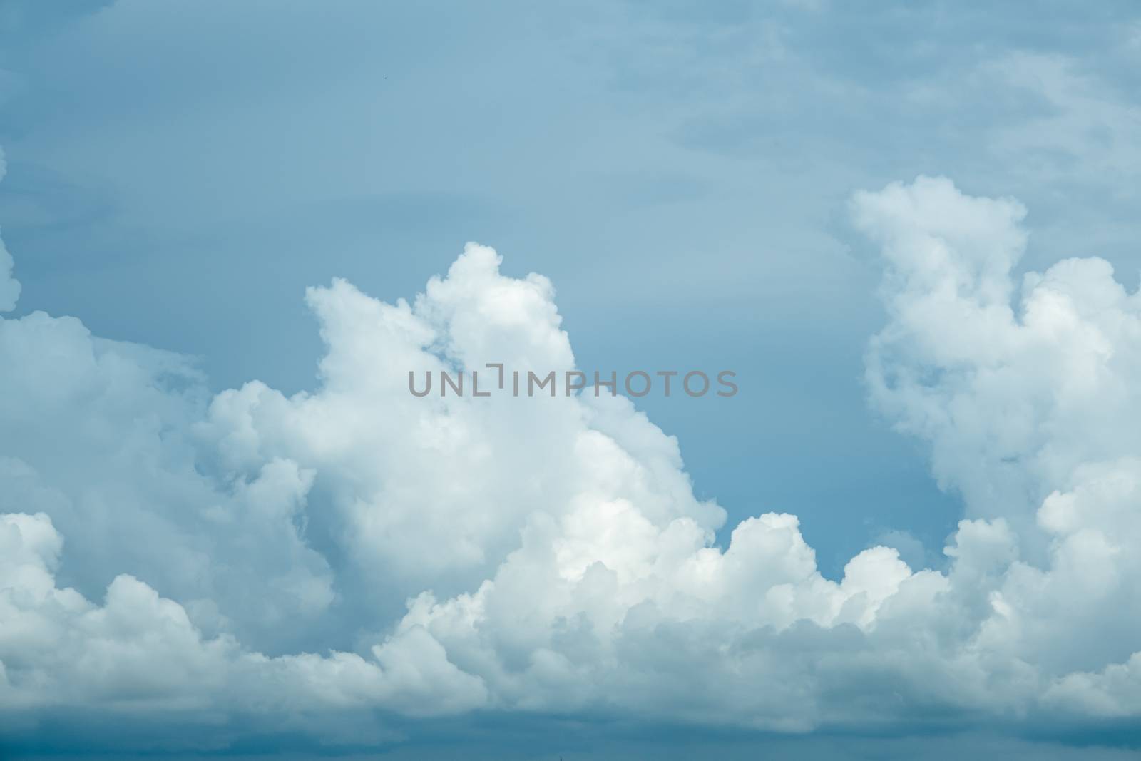 Photo of some white clouds and blue sky cloudscape for background use by peerapixs