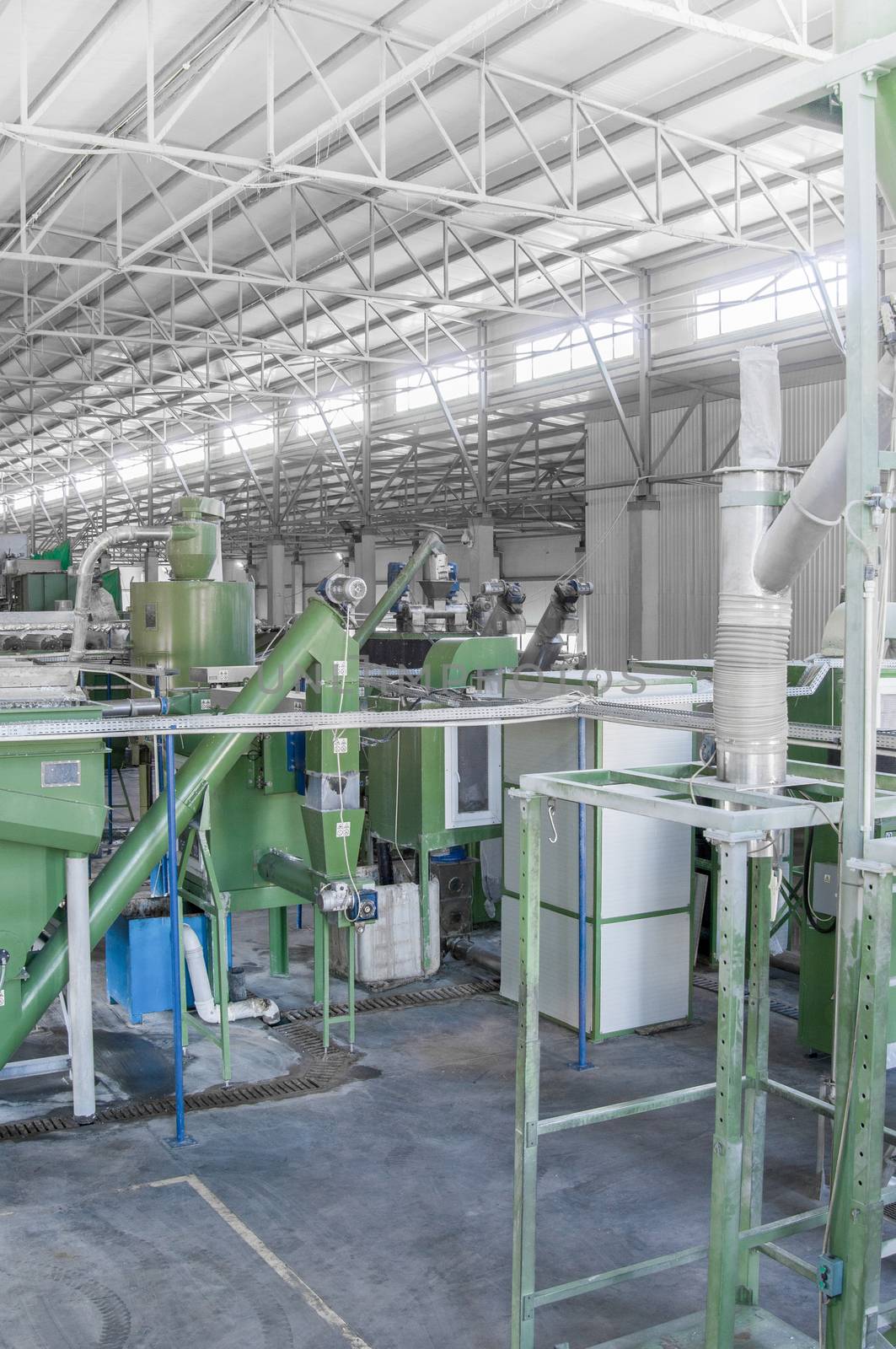 factory equipment for processing and recycling of plastic bottles. PET recycling plant