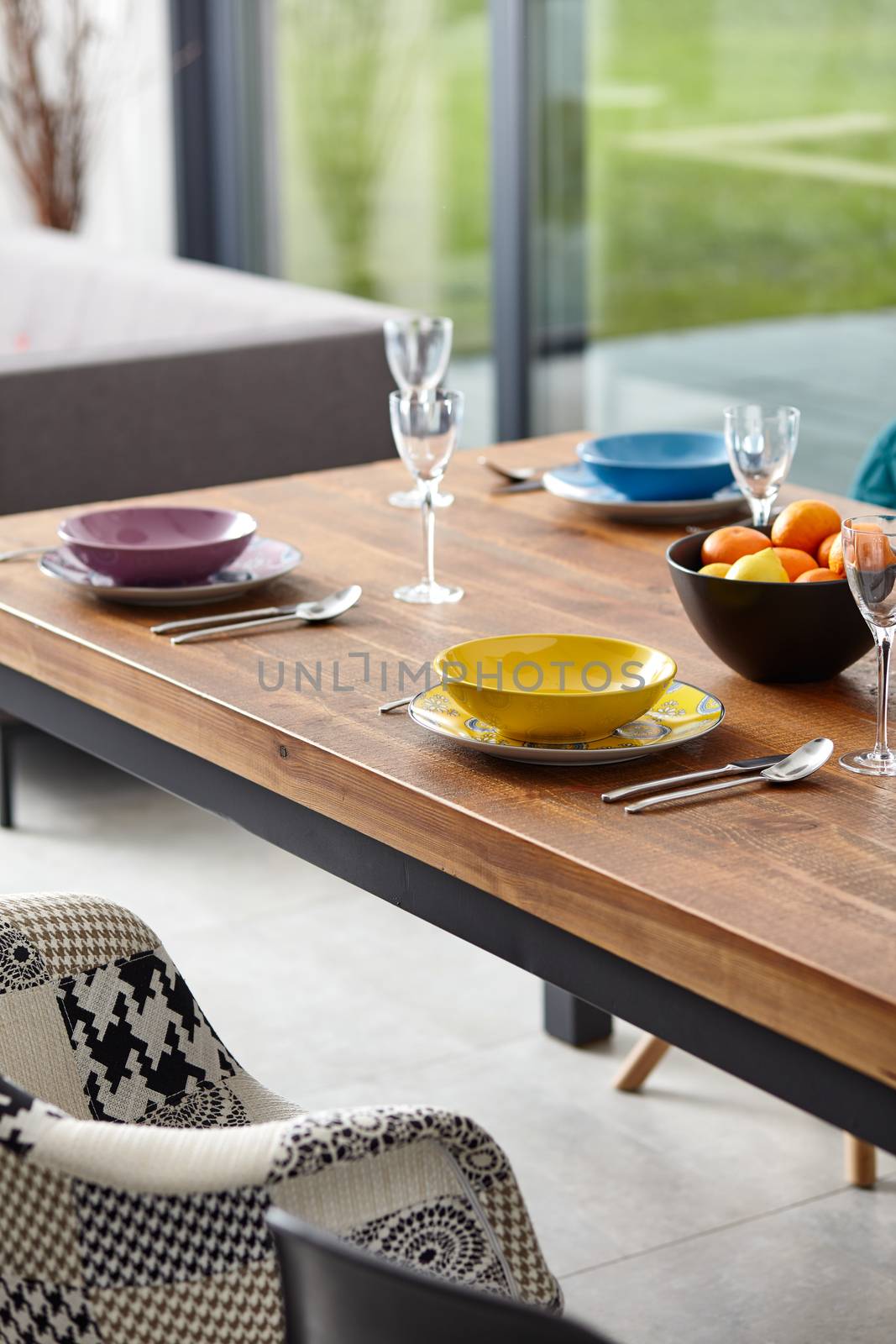 Modern dining room with dining table.  Small depth of field by ArturNyk