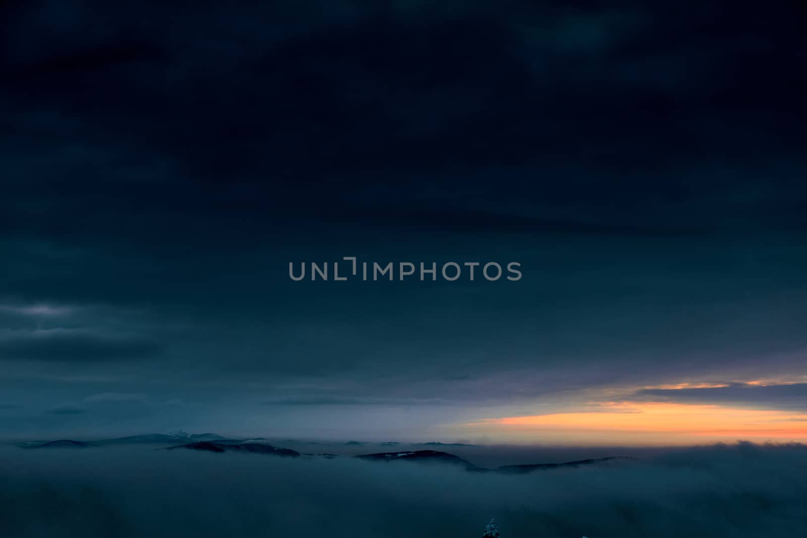 Winter sunset after a storm over the mountains. Beskids, view from the route between Szyndzielnia and Klimczok, Poland