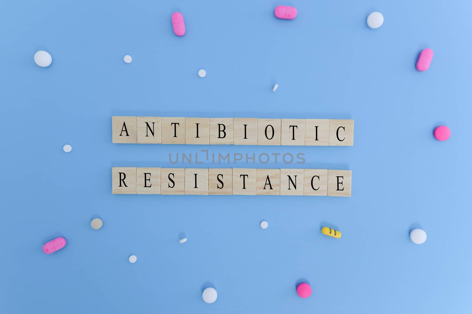 Concept showing of Antibiotic resistance with medicines or pills in wooden block letters. by lakshmiprasad.maski@gmai.com