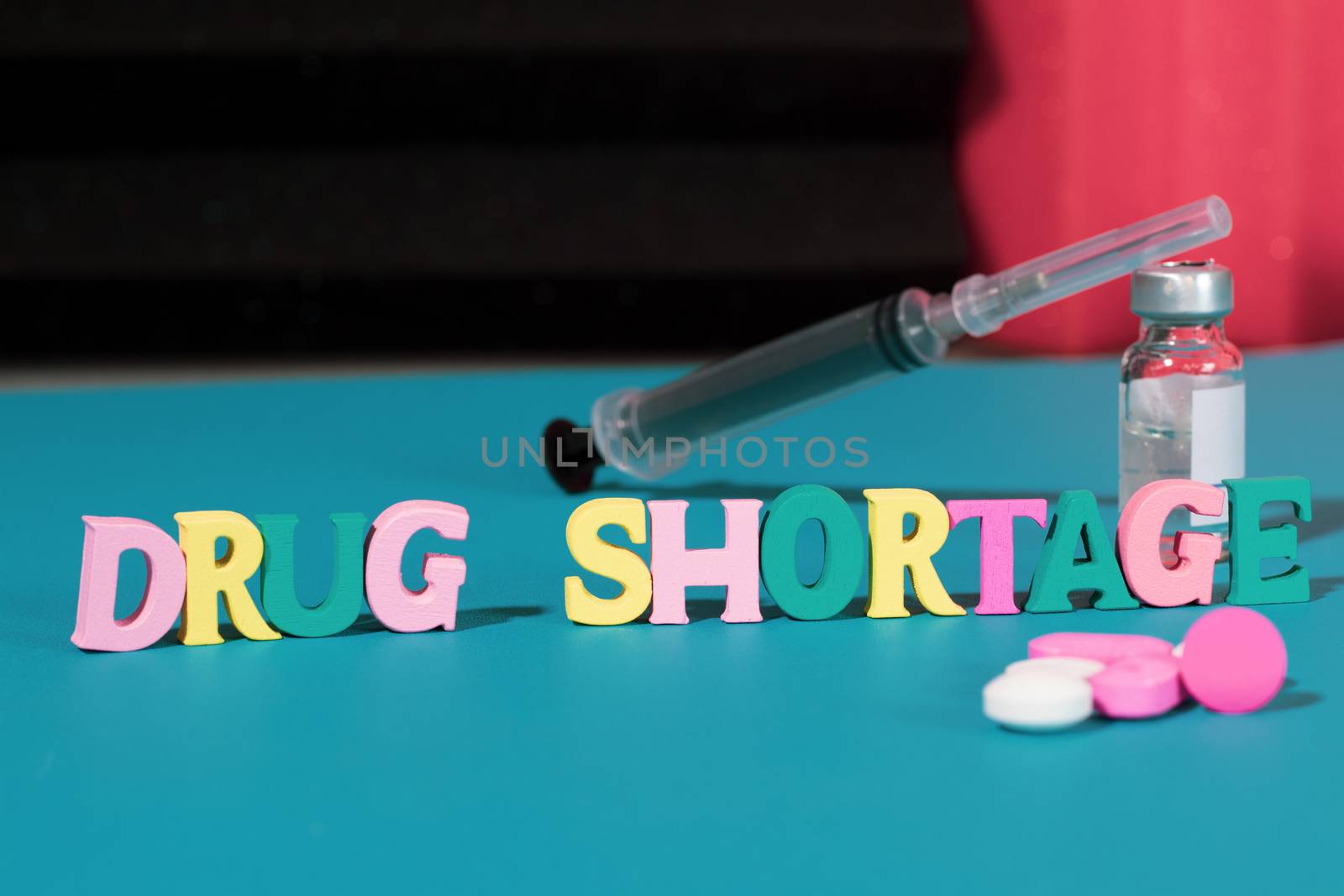 Concept of Drug shortage, Showing with letters, pills and syringe due to global covid-19 or coronavirus pandemic by lakshmiprasad.maski@gmai.com