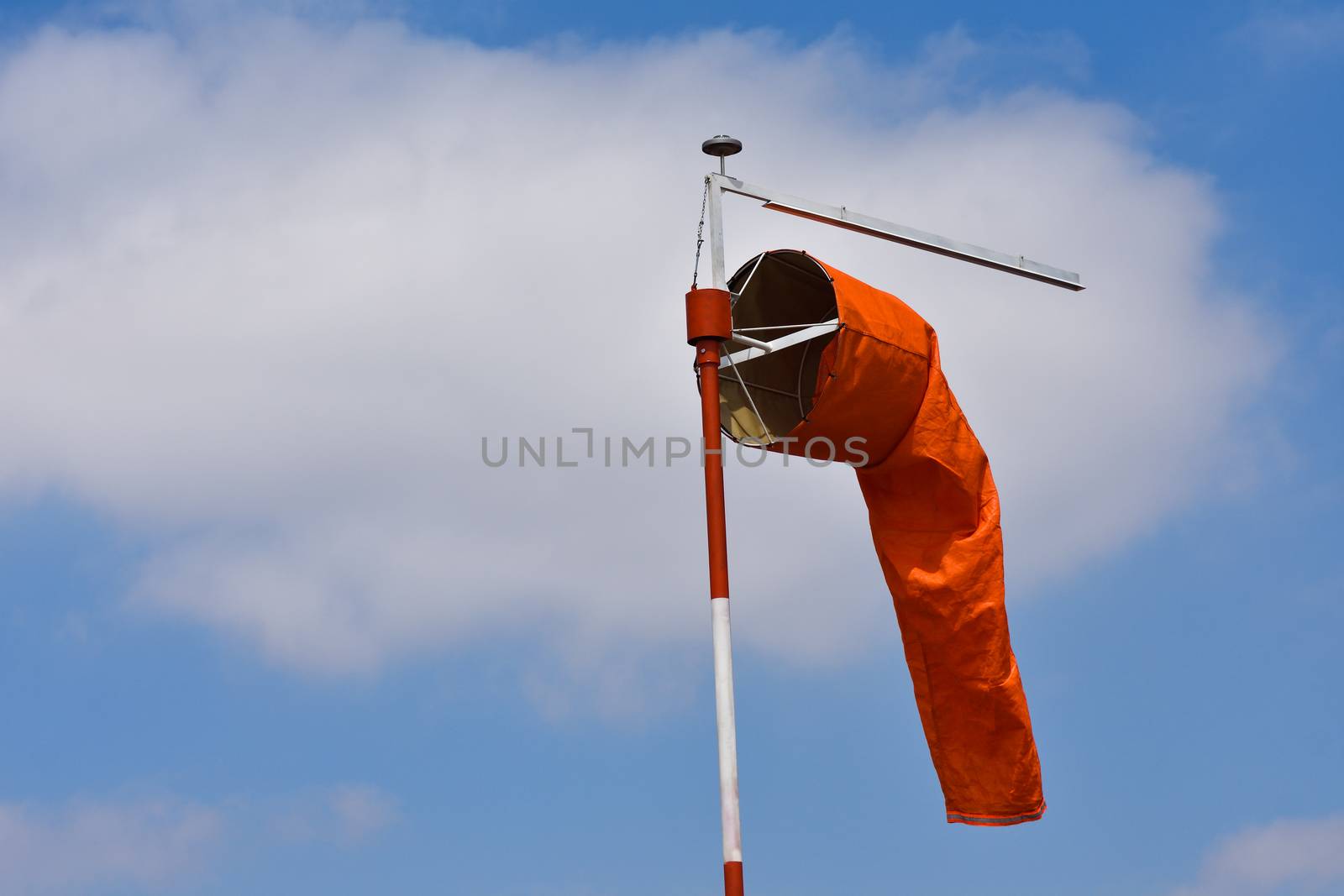 A bright orange wind indication windsock at an airport, Pretoria, South Africa