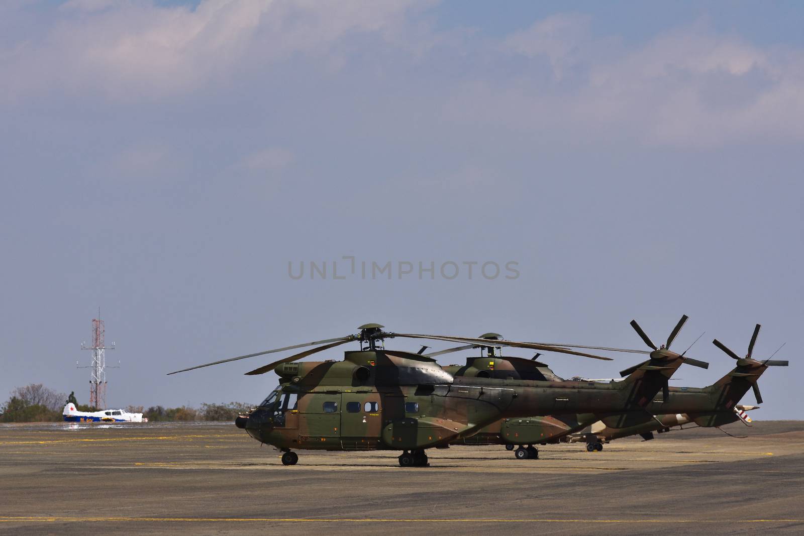 Military Atlas Oryx Helicopters Parked On Airfield by jjvanginkel