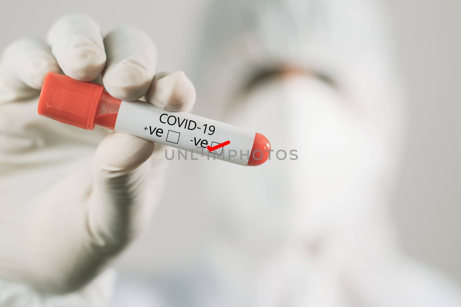 Doctor hand holding negative sample blood test tube of coronavirus, covid-19 or 2019-nCoV in laboratory