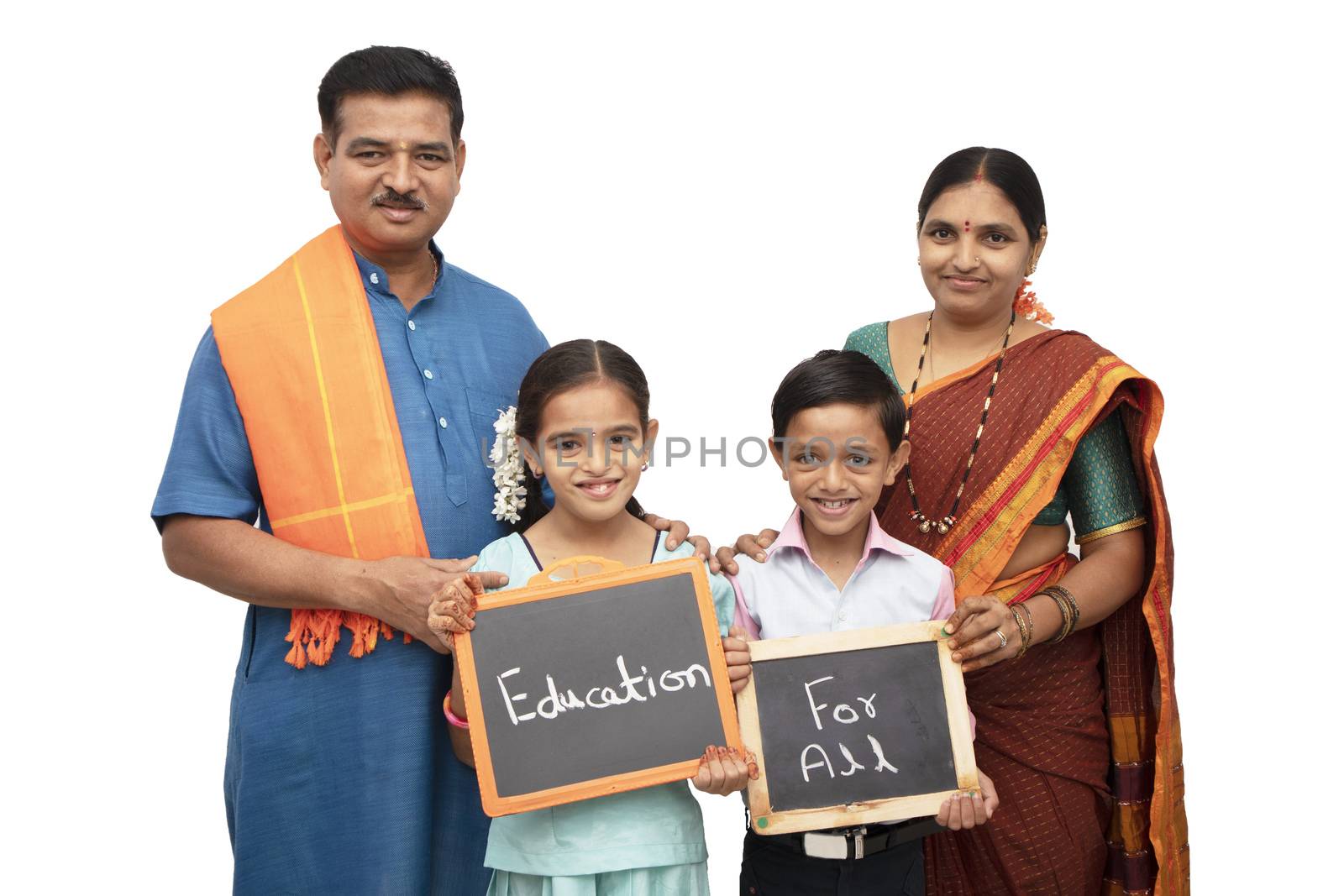 Concept of Education for all children holding slate with traditional Indian family on isolated background by lakshmiprasad.maski@gmai.com