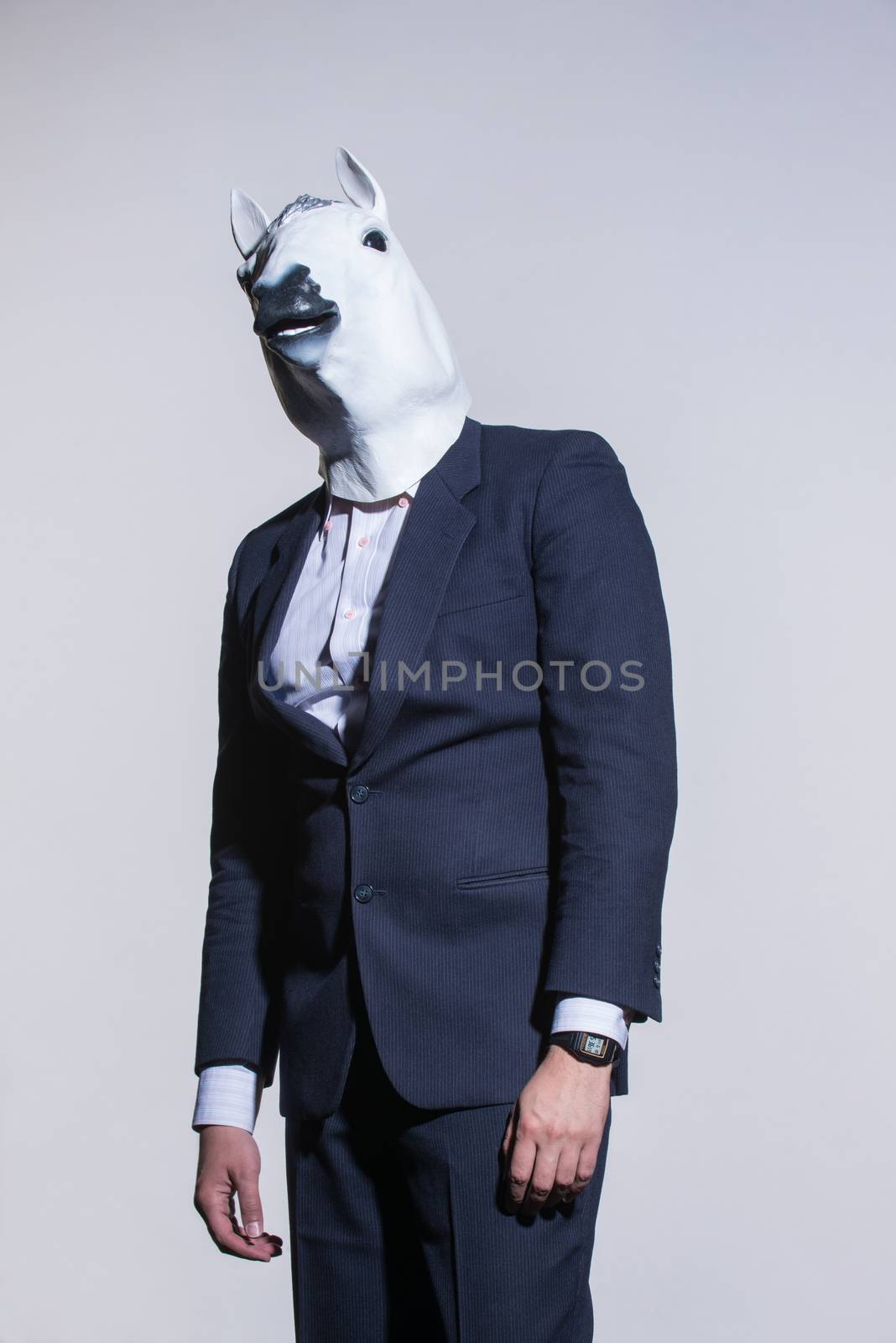 man with a horse mask on a light background by A_Karim