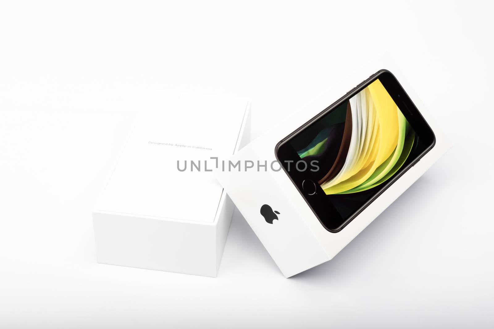 Paris, France - May 14, 2020: packaging of the new black iPhone SE 2020 from the multinational company Apple during the days of its studio release on a white background