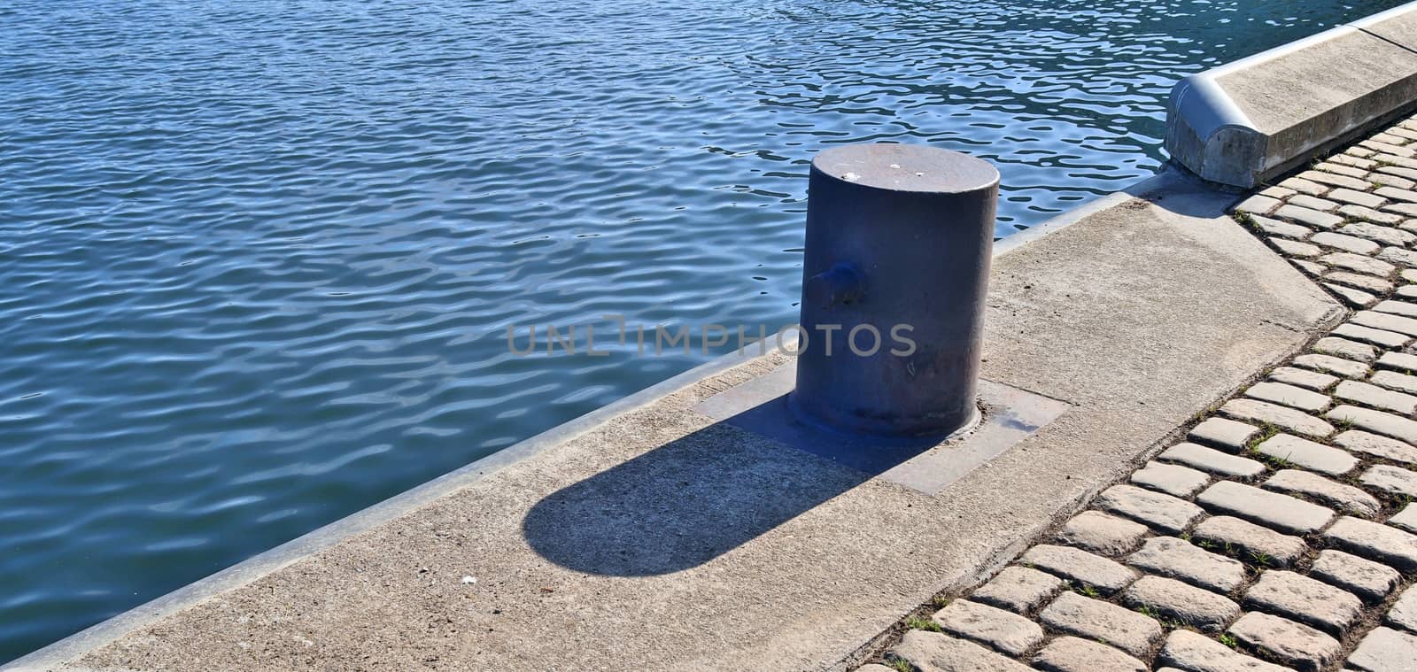 Different bollards and technical installations of vessel traffic at a port .