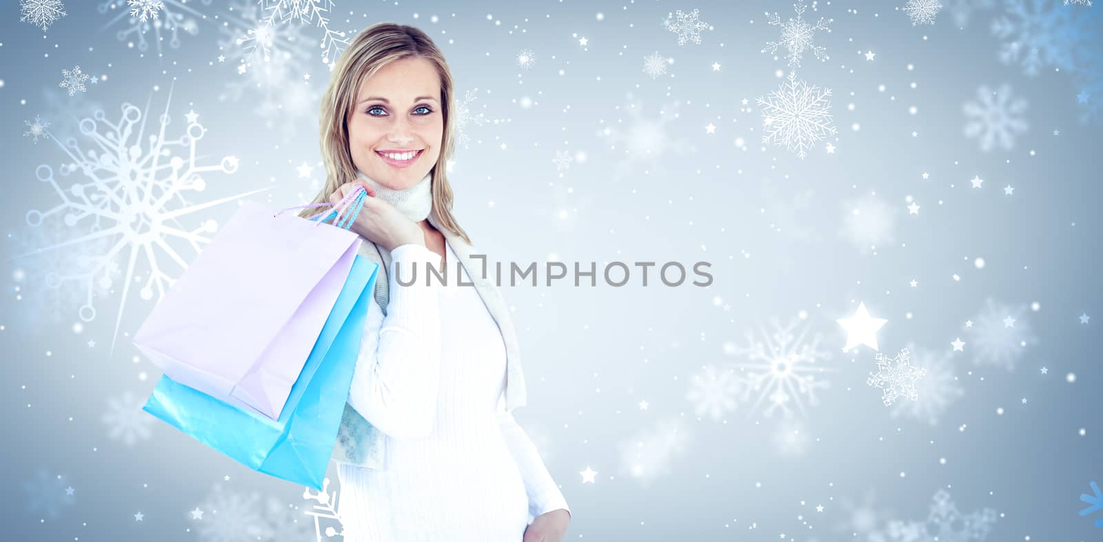Handsome woman holding shopping bags against white background against snowflake pattern
