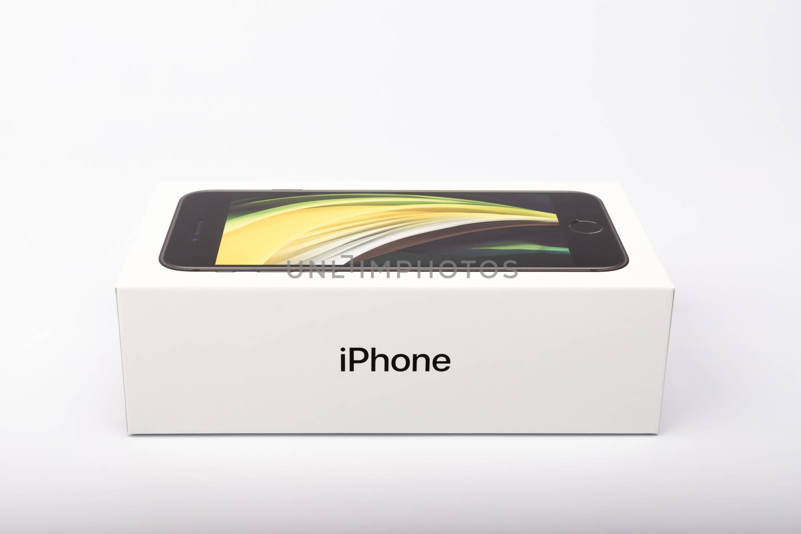 Paris, France - May 14, 2020: packaging of the new black iPhone SE 2020 from the multinational company Apple during the days of its studio release on a white background