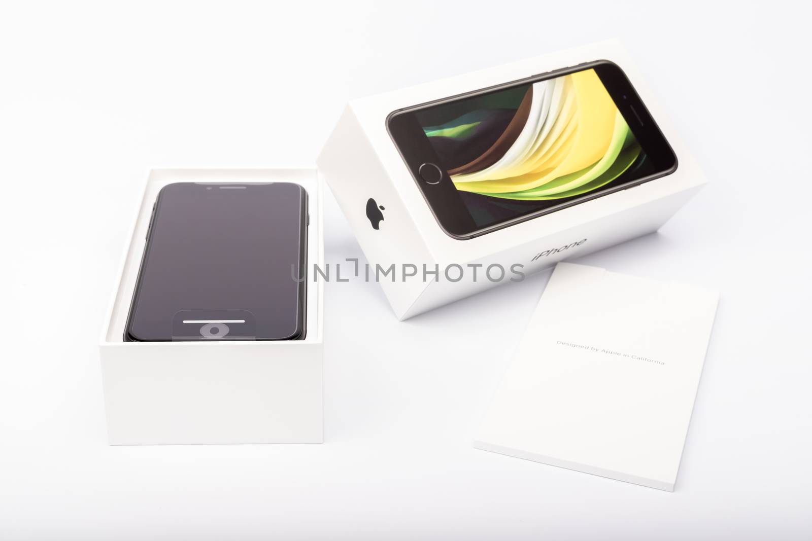 Paris, France - May 14, 2020: packaging of the new black iPhone SE 2020 from the multinational company Apple during the days of its studio release on a white background