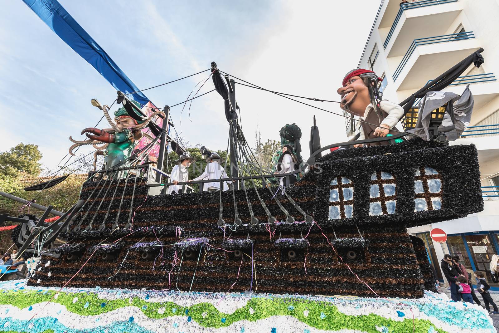 Loule, Portugal - February 25, 2020: Float parading in the street in front of the public in the parade of the traditional carnival of Loule city on a February day