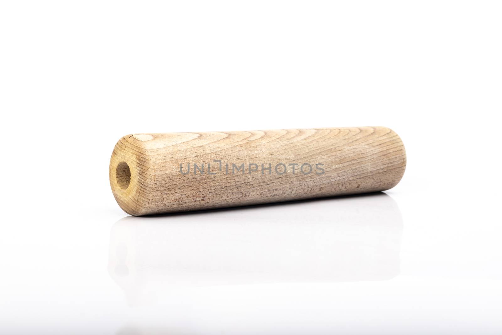 wooden rolling pin on white background in studio