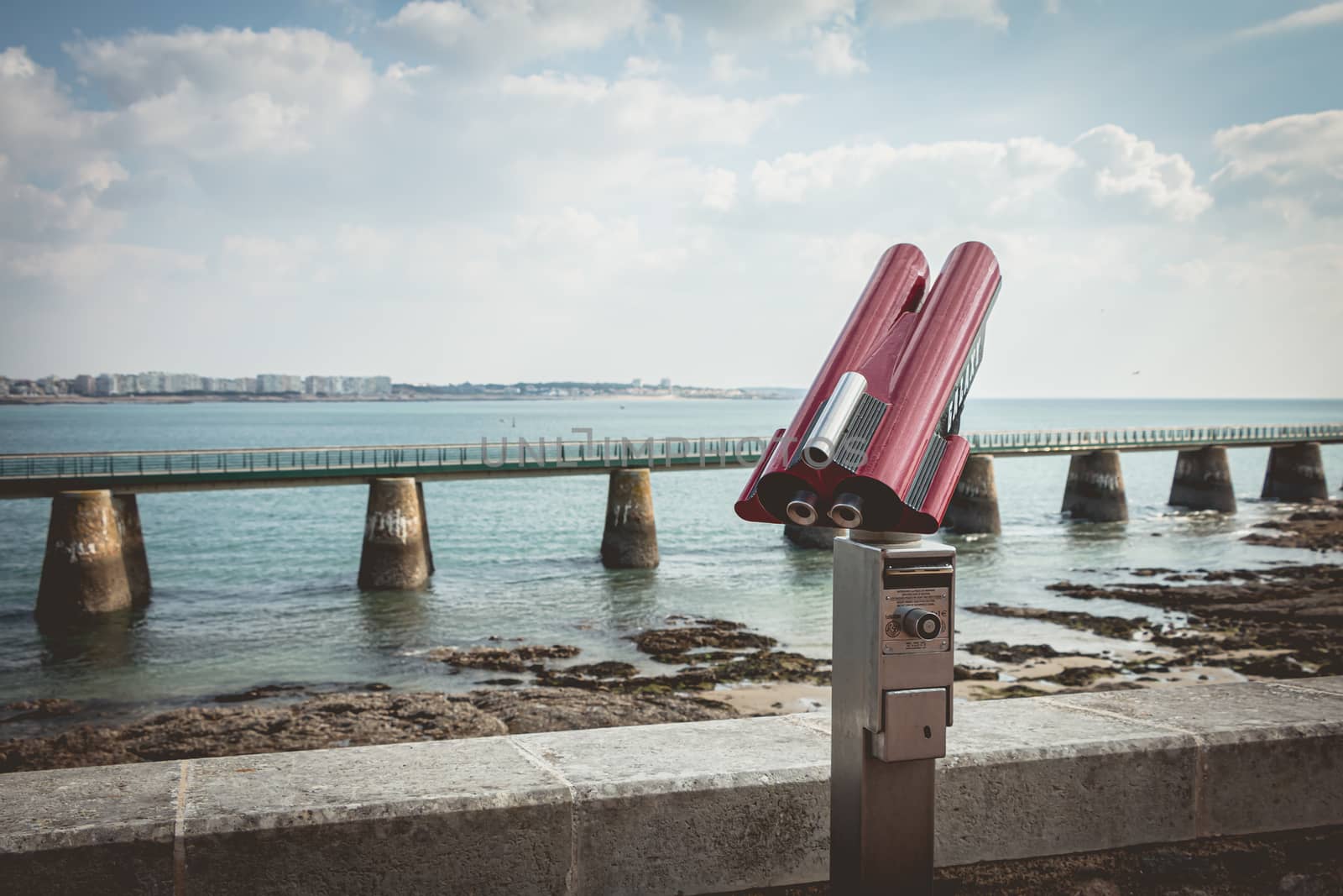 Sables d Olonne, France - October 13, 2015 : binocular telescope for tourist pointed to the beach on a fall day