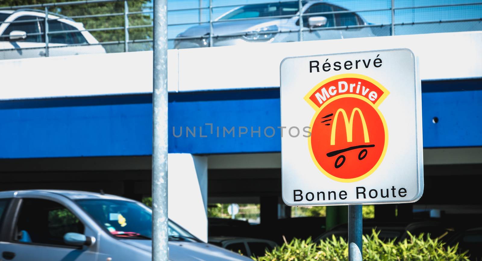 Road sign indicating a place reserved for McDrive customers in t by AtlanticEUROSTOXX