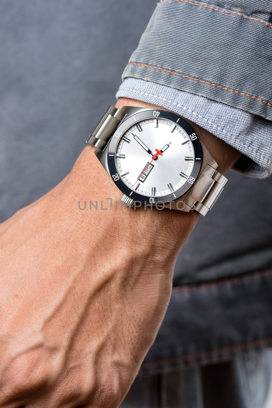 closeup luxury watch on man's wrist