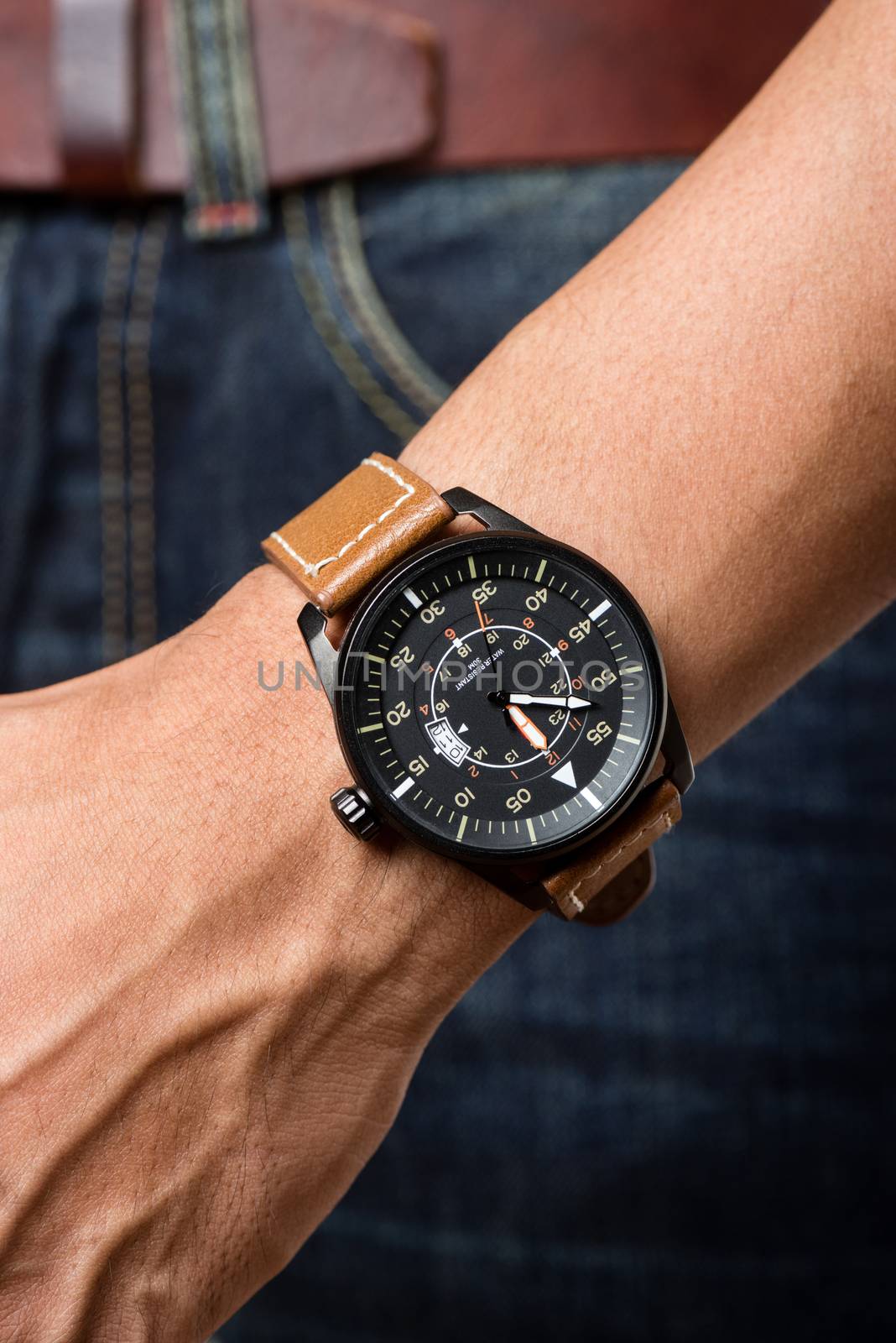 closeup luxury watch on man's wrist