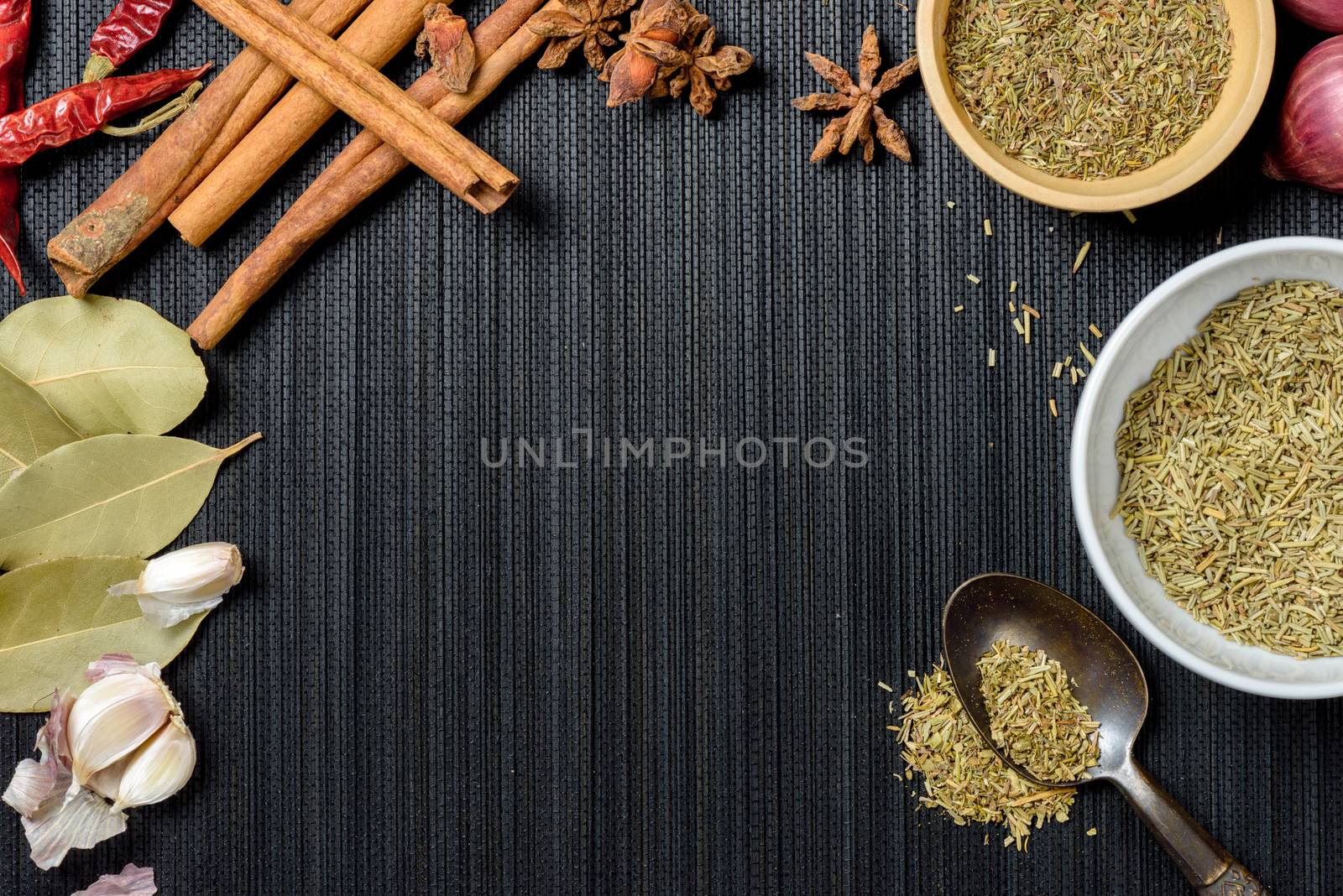 many herbs on black background with space. herbs for cooking.