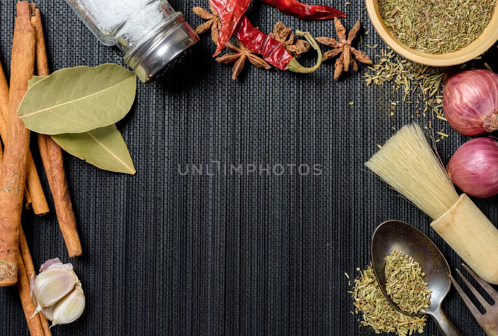 many herbs on black background with space. herbs for cooking.