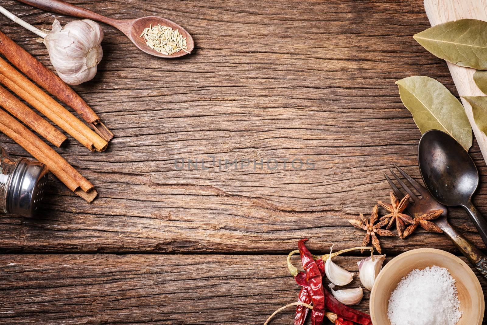 many herbs on wooden background with space. herbs for cooking.