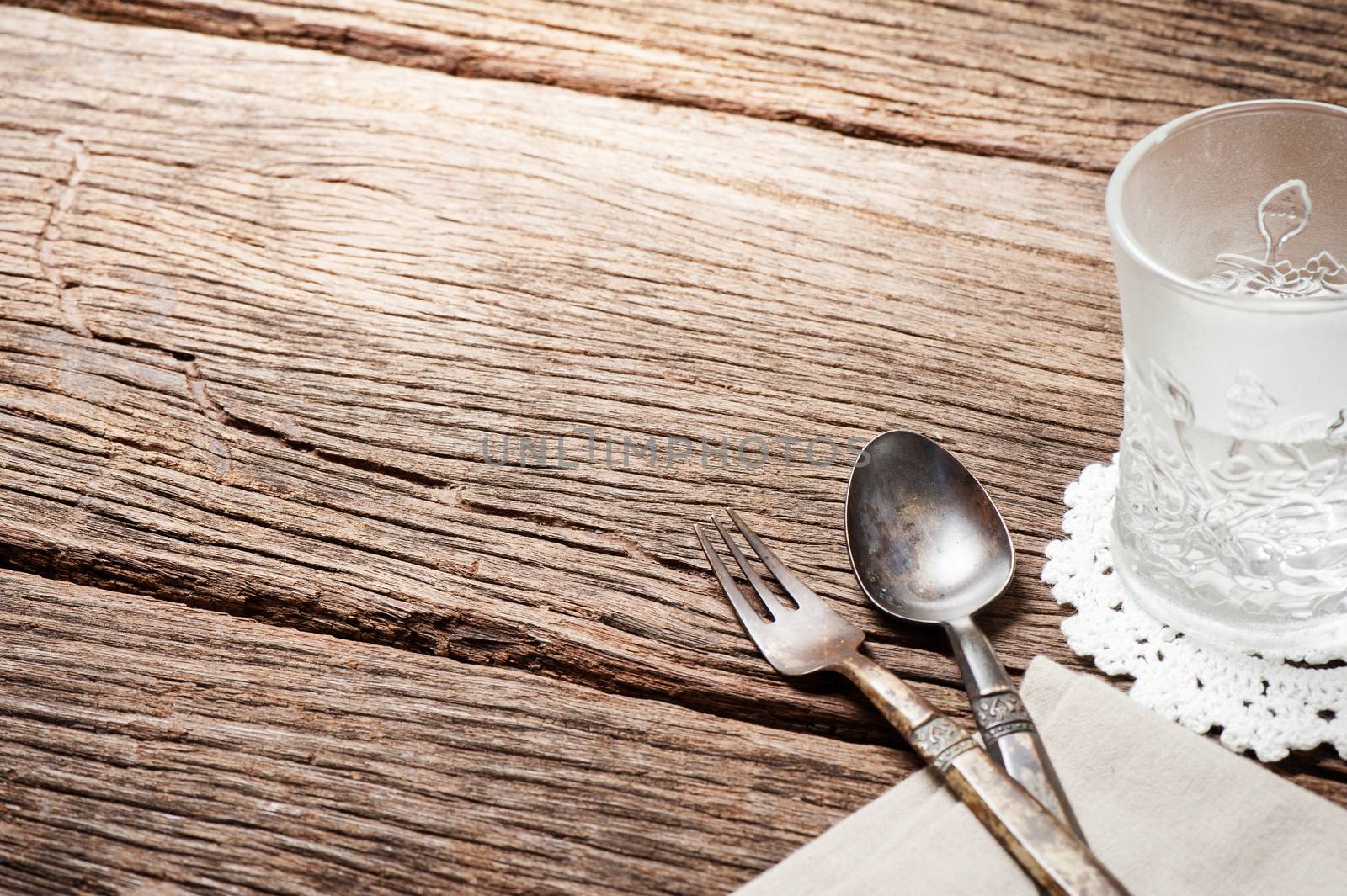 dinning table with old brass spoon and fork