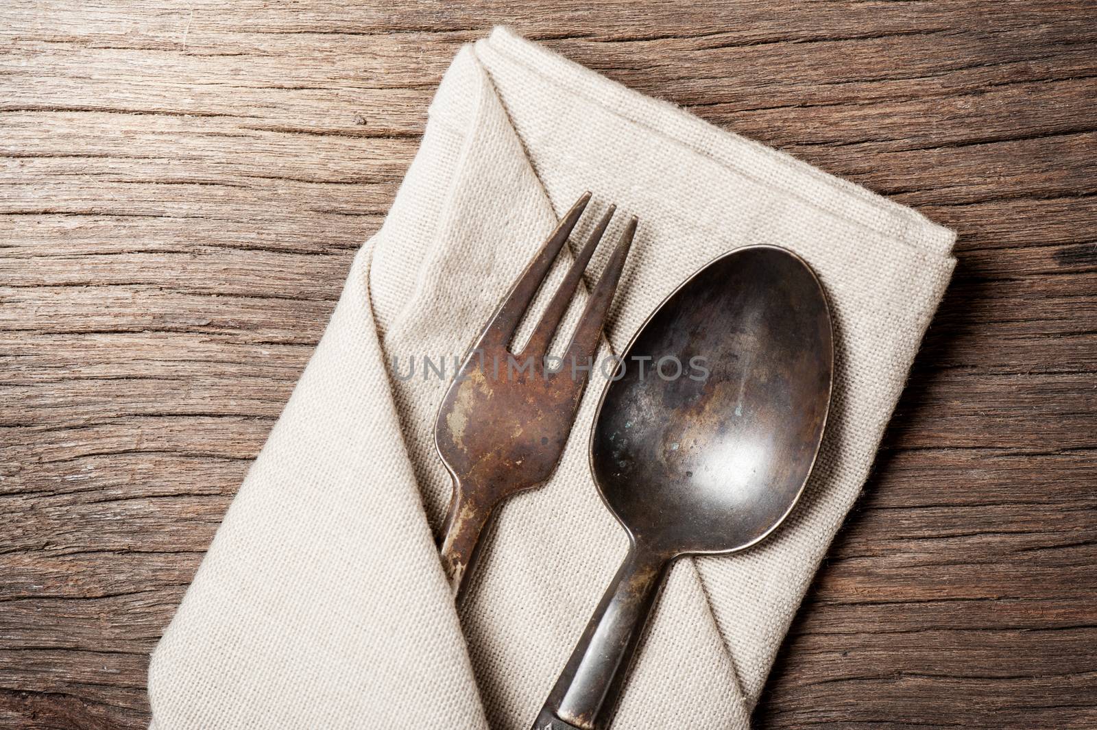 dinning table with old brass spoon and fork