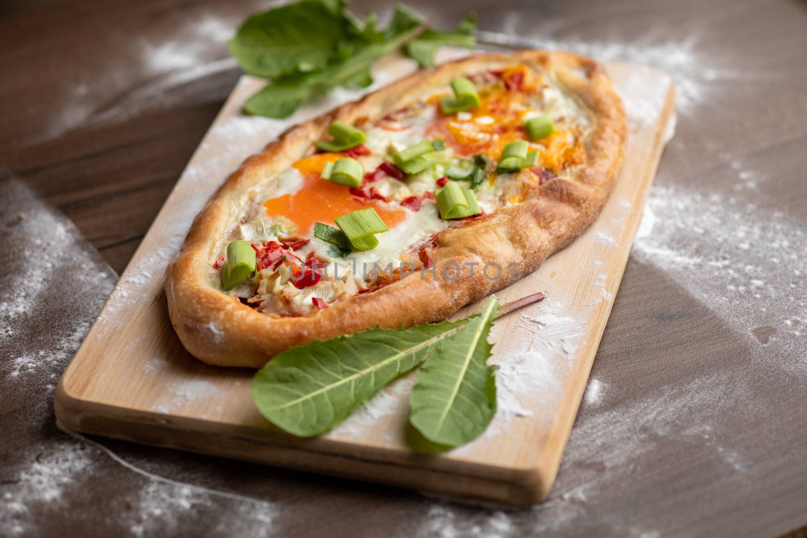 Quick food meal - Egg beacon cheesee pizza decorated with dandelion leafs