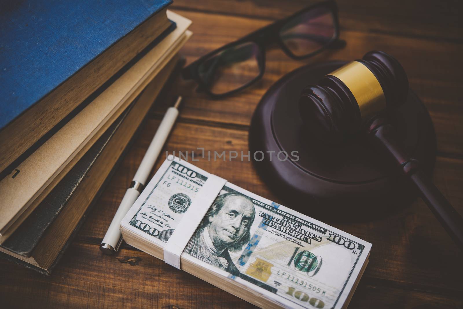 Law theme, mallet of the judge, law enforcement officers, evidence-based cases, and documents taken into account.