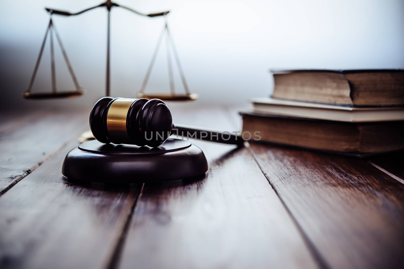Law theme, mallet of the judge, law enforcement officers, evidence-based cases, and documents taken into account.