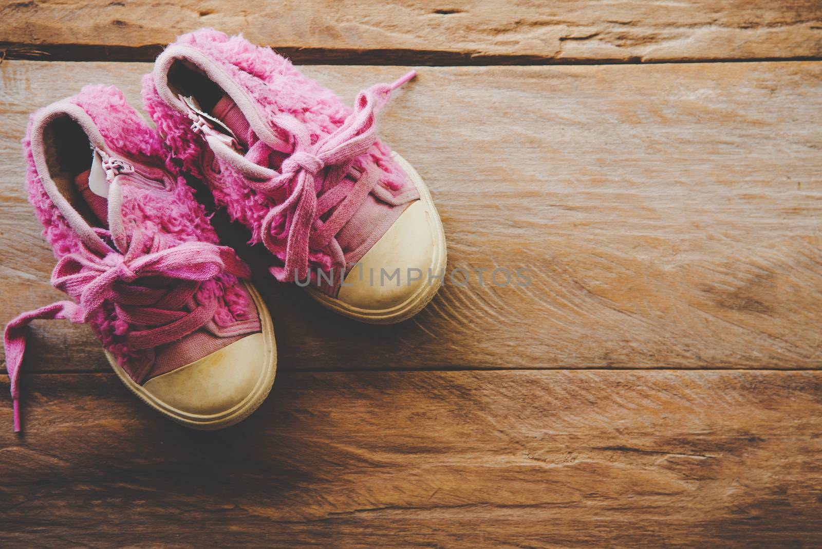 shoes for children on wooden floor