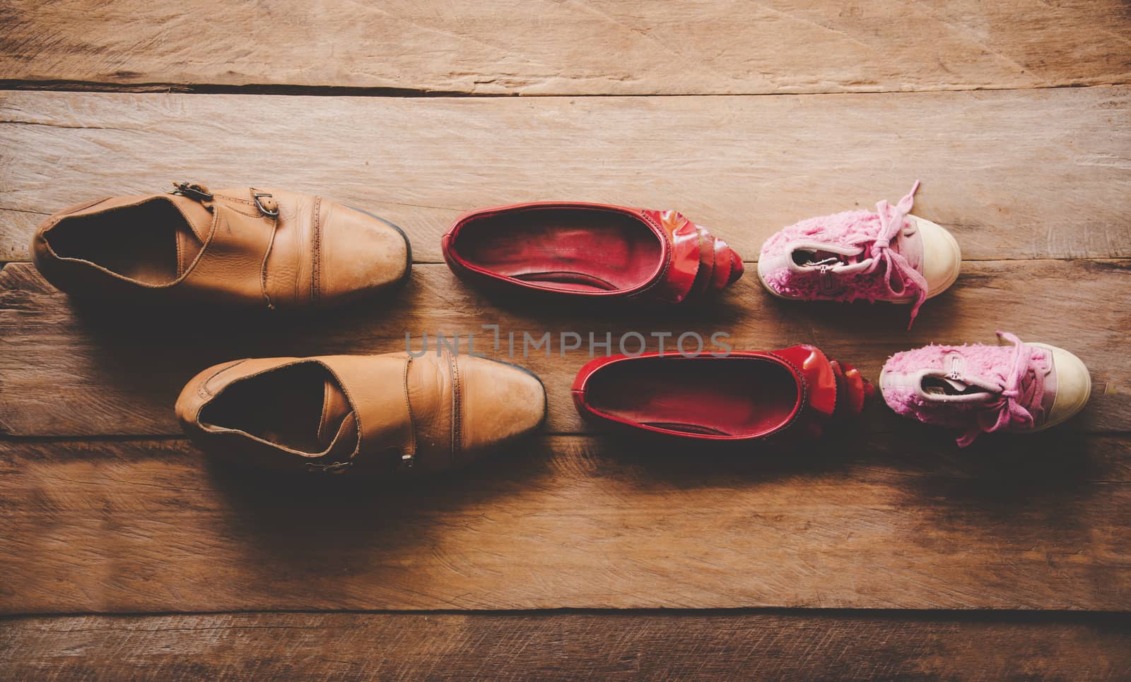 shoes, three pairs of dad, mom, daughter - the family concept 