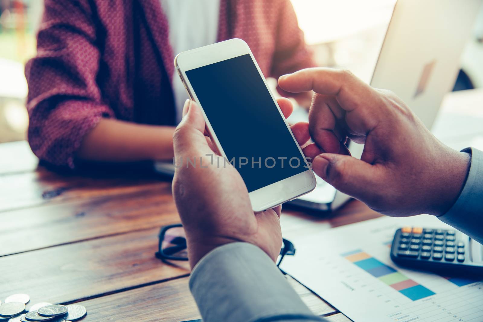 hands business holding blank screen mobile in desk work.