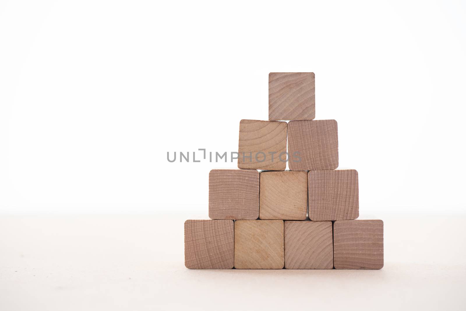 Wooden blocks placed on a white background represent the stability of doing business.