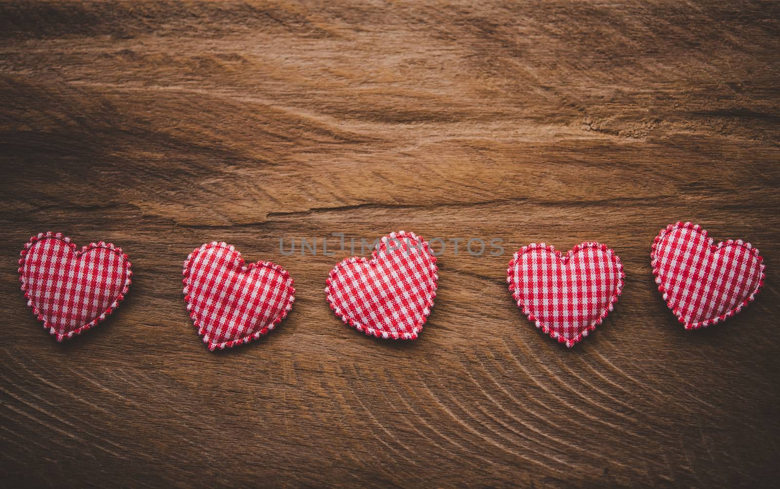 The heart lay on the wooden floor - Valentine Day concept.