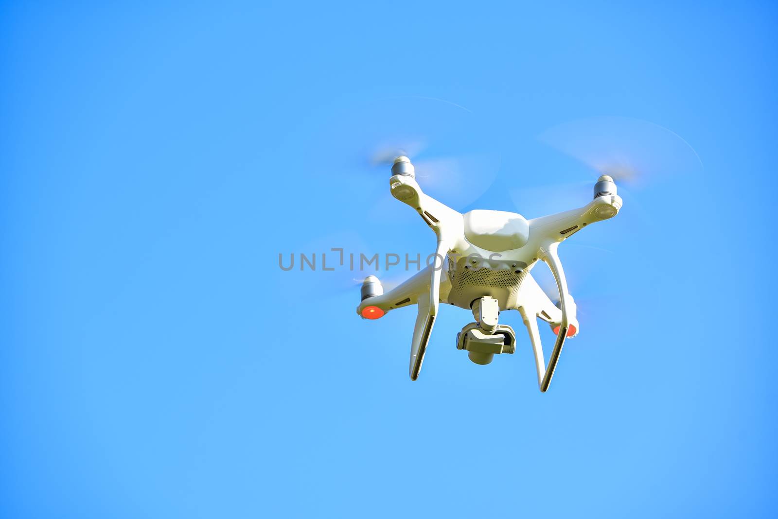 drone quad copter with  digital camera on the sky 