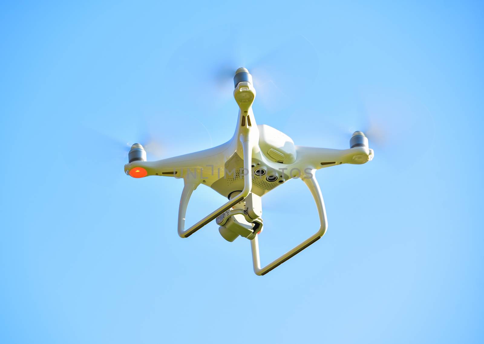 drone quad copter with  digital camera on the sky 