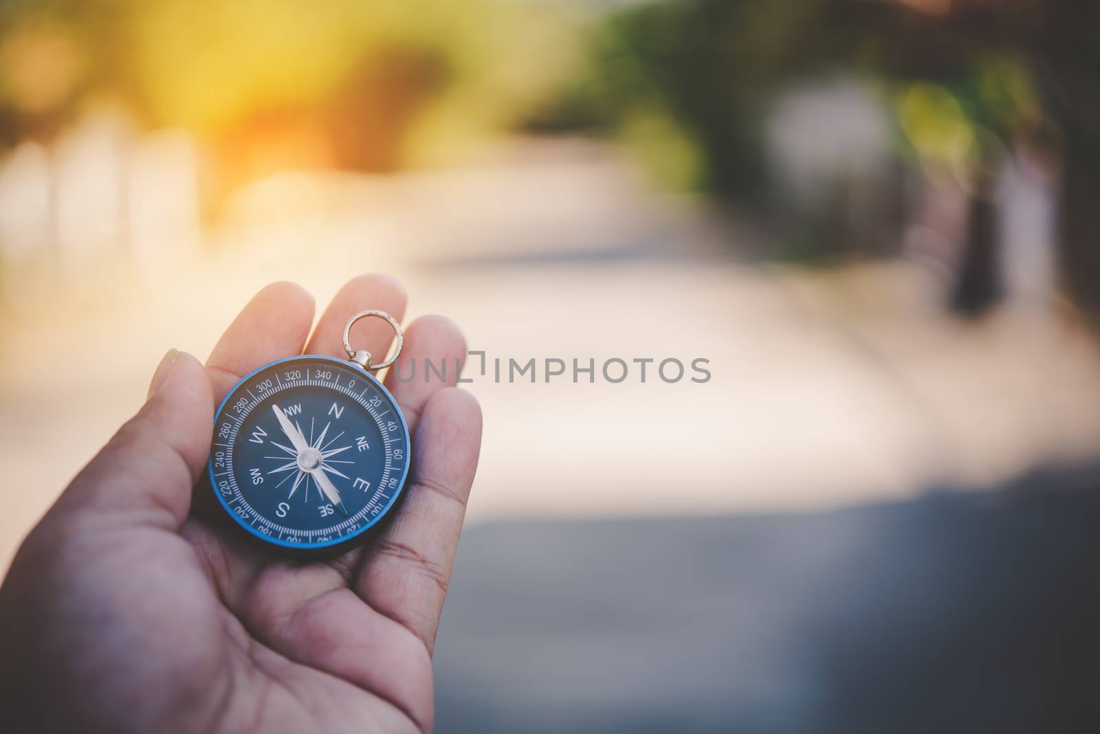Compass in the hand ,Tourists hold a compass and locate a place