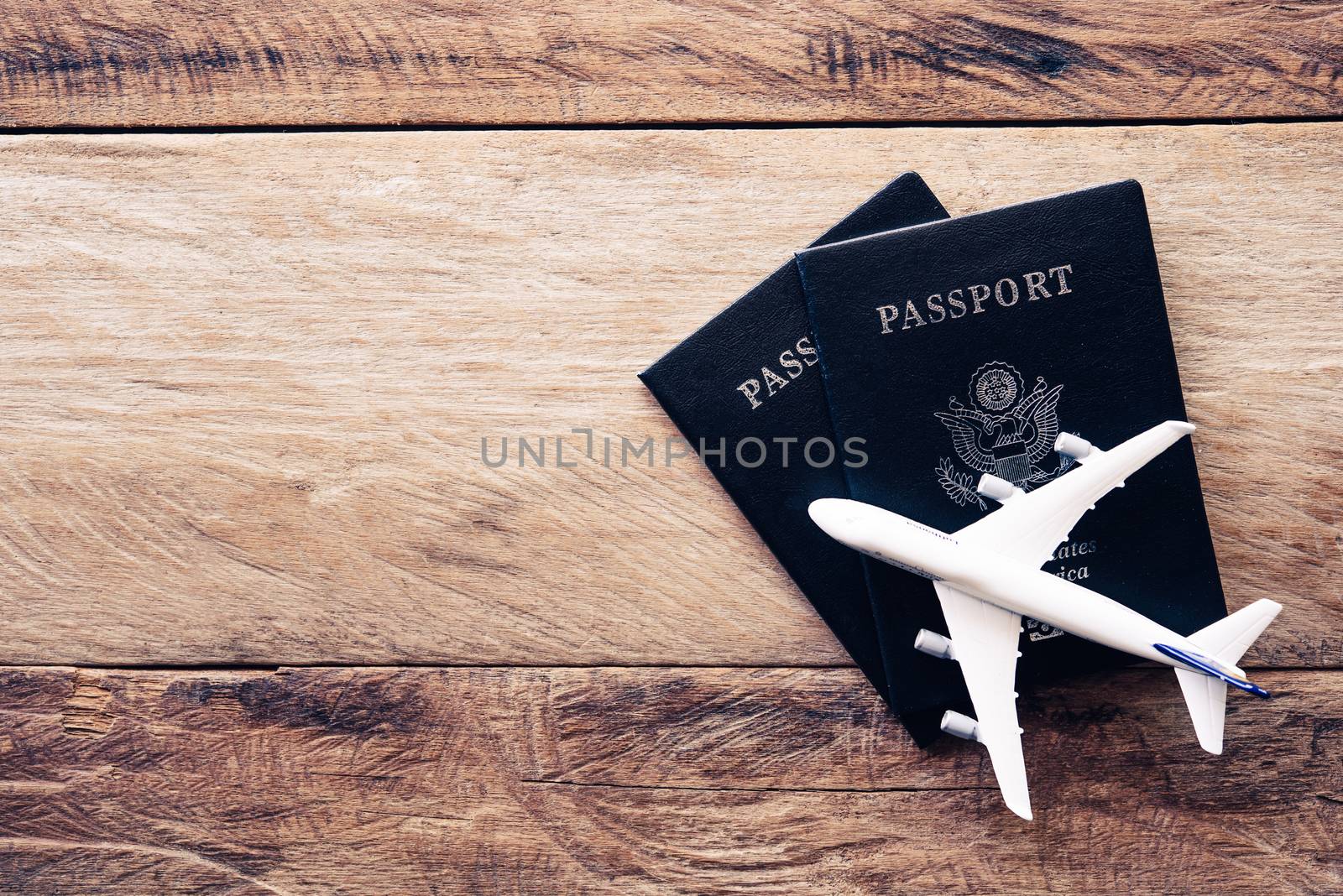 top view  passport  on wooden table, for travel concept