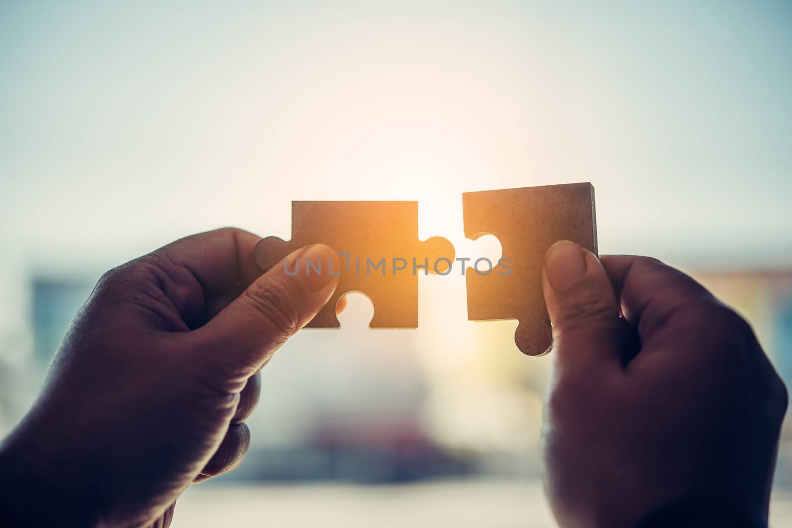 Business people are taking puzzles to connect. Ideas about building a business network.