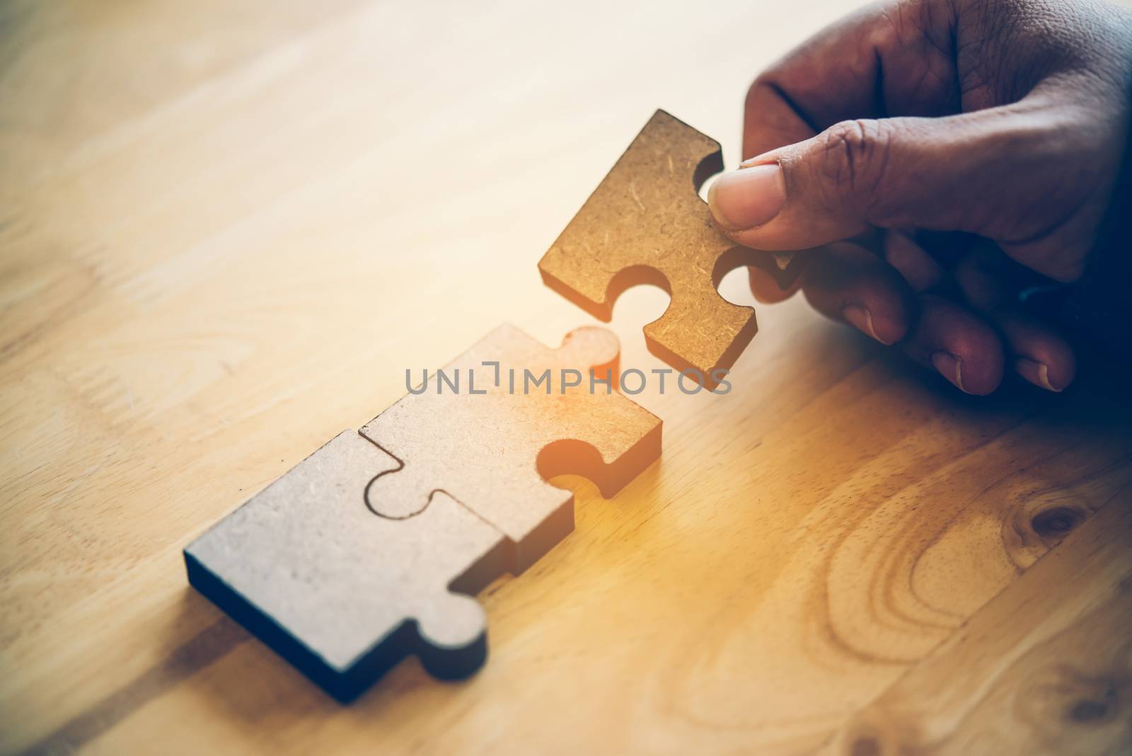 Business people are taking puzzles to connect. Ideas about building a business network.