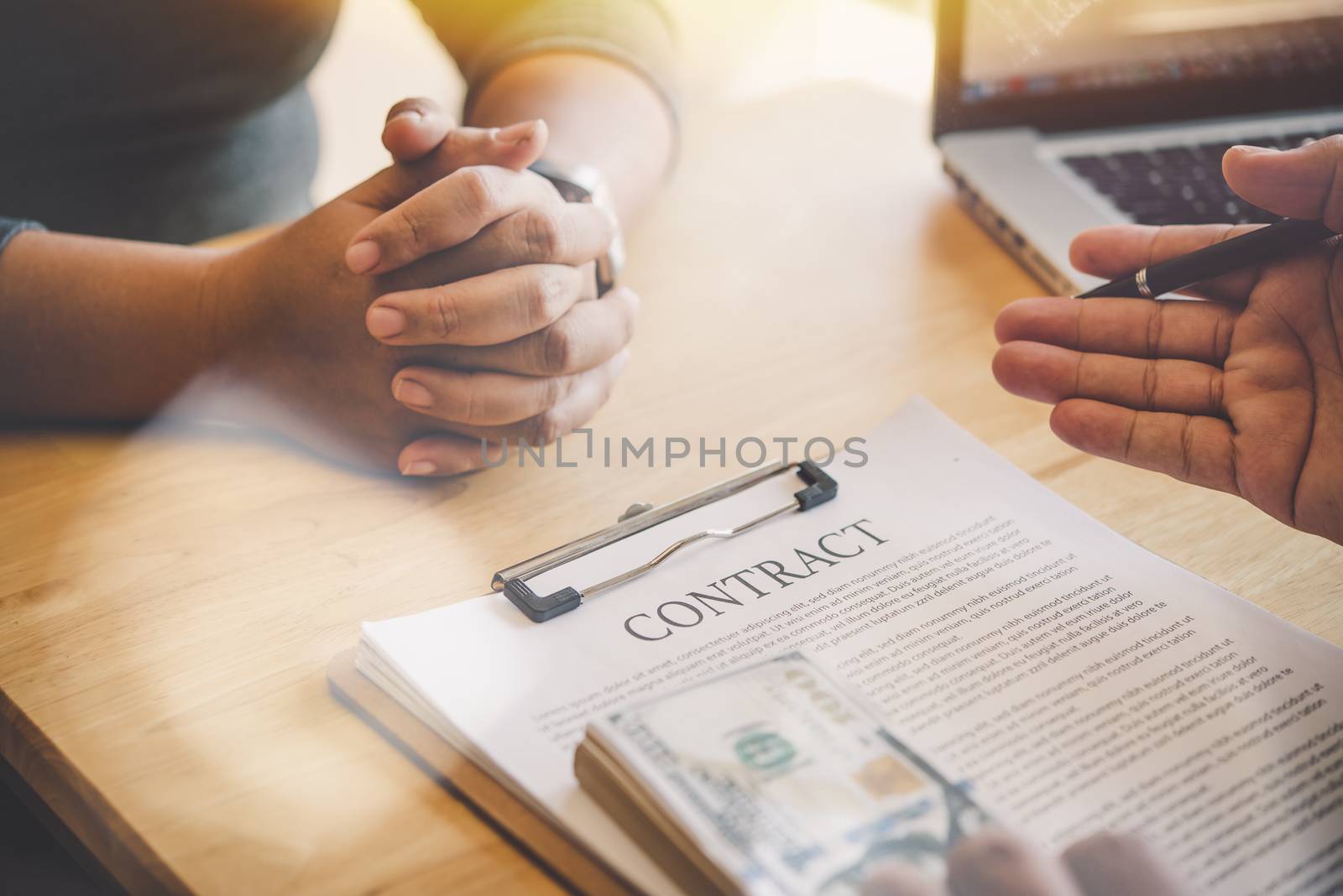 Business team is working on accounting documents and team work together to present the work and help solve the problem.