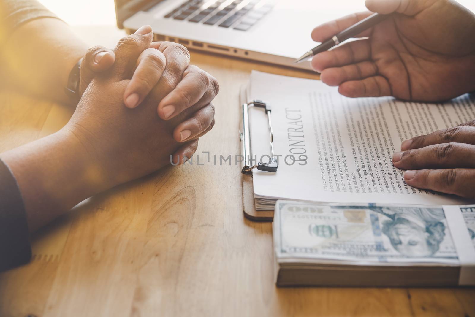 Business team is working on accounting documents and team work together to present the work and help solve the problem.