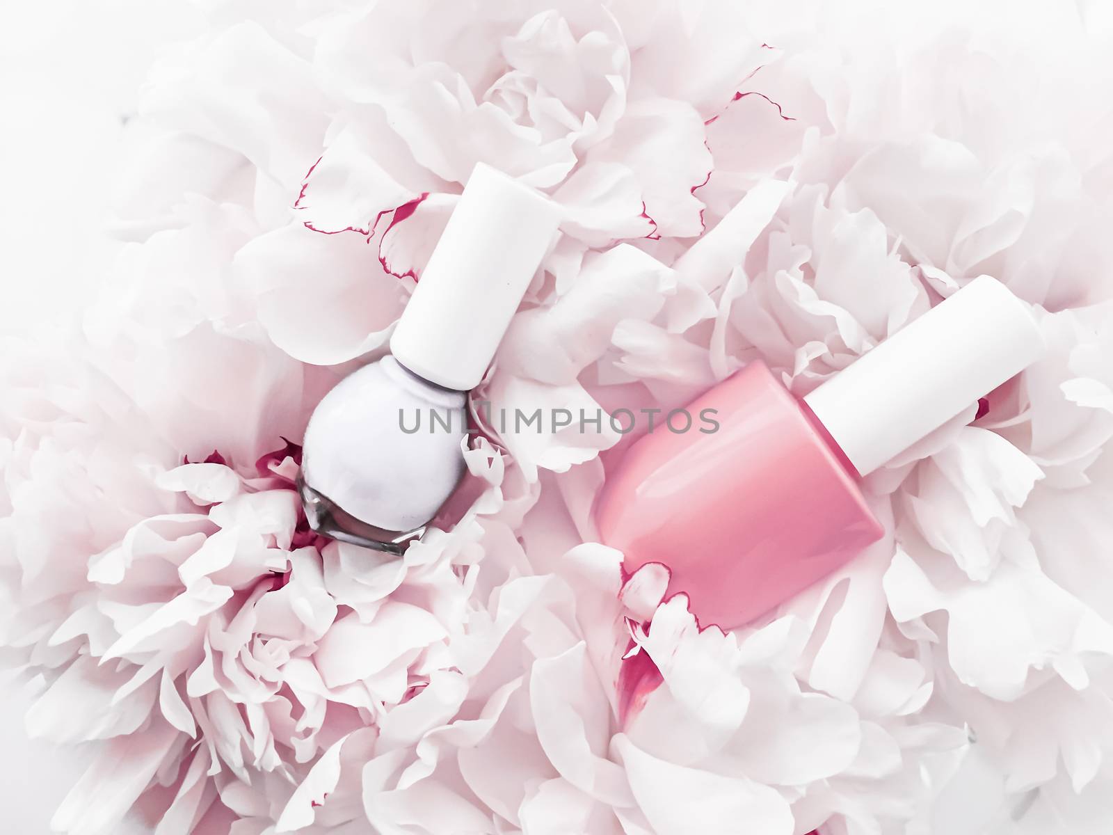 Nail polish bottles on floral background, french manicure and cosmetic branding by Anneleven