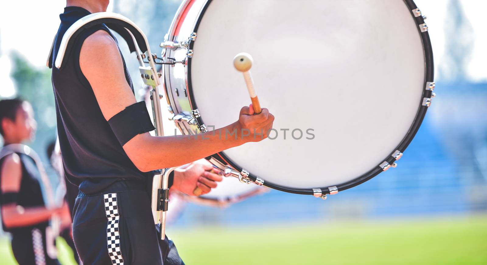 Close-up of marching band drummers marching 