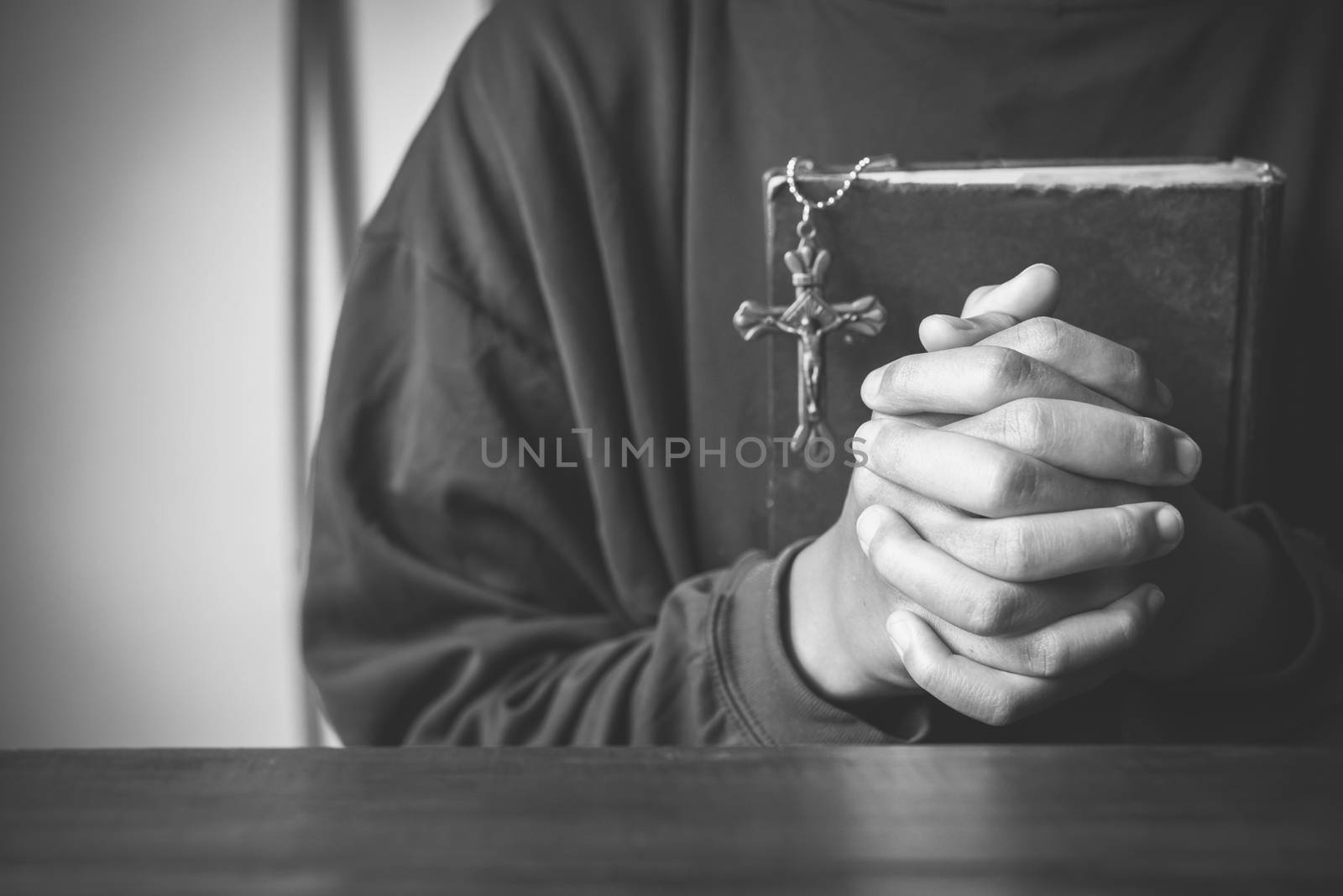 hands woman laying on the biblical while praying for christian religion blessings and Pray to God