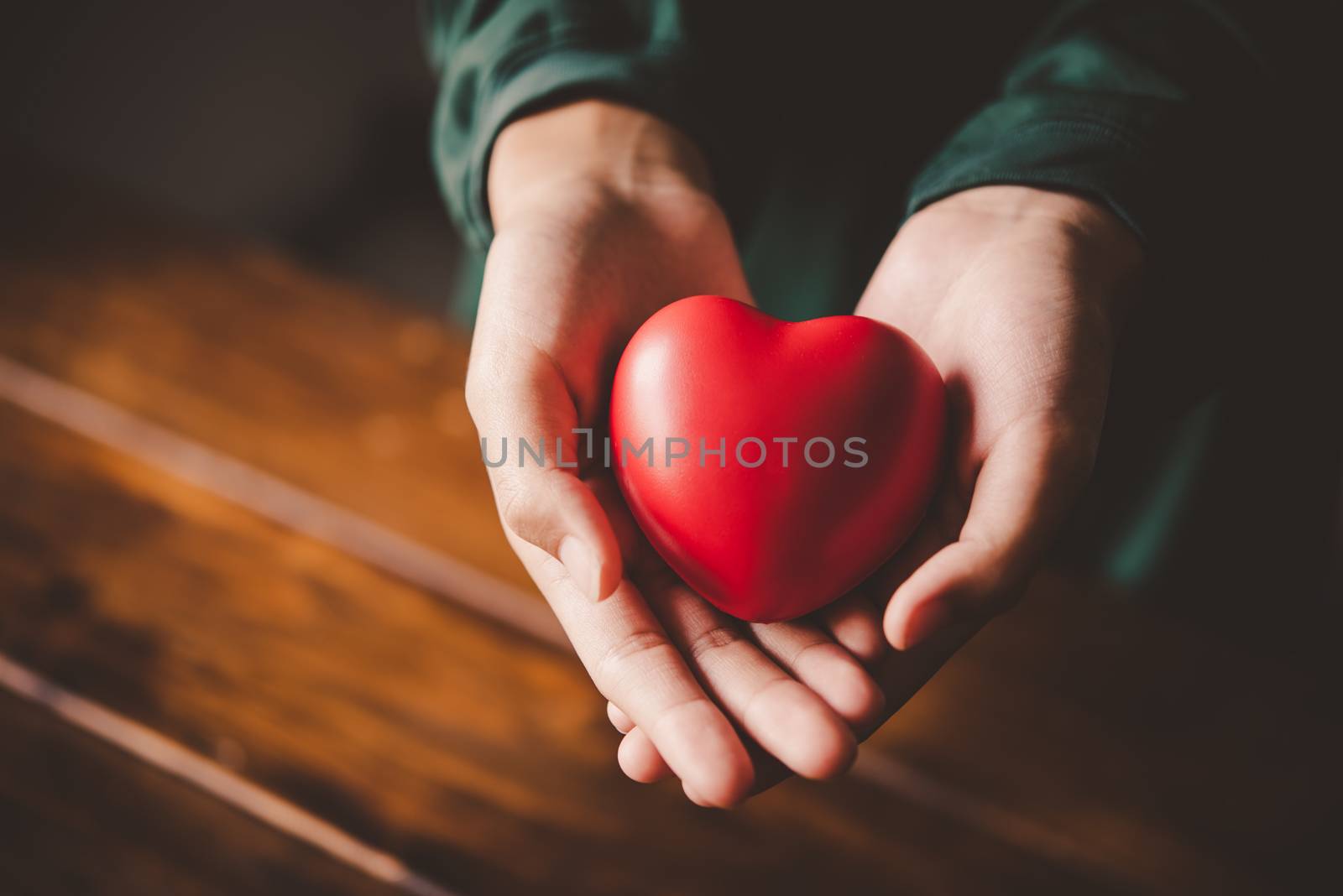 Hand give red heart for love