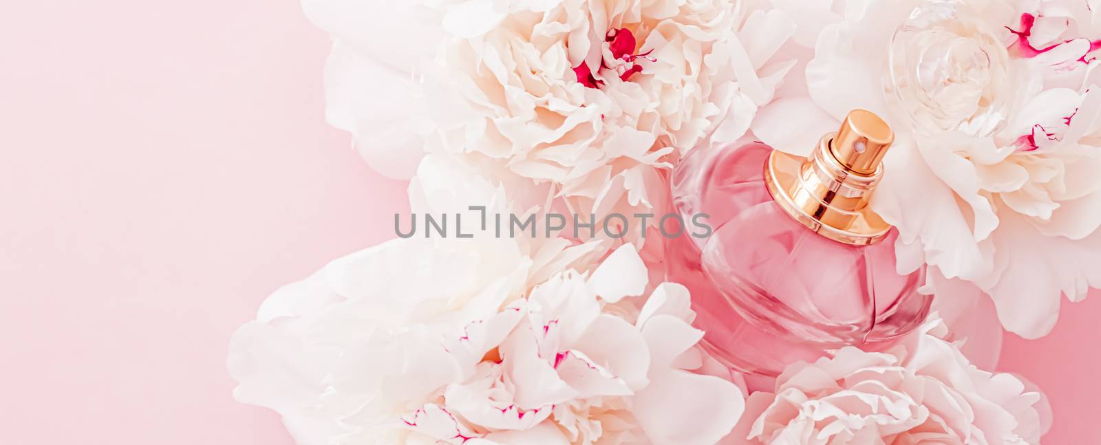 Luxe fragrance bottle as girly perfume product on background of peony flowers, parfum ad and beauty branding by Anneleven