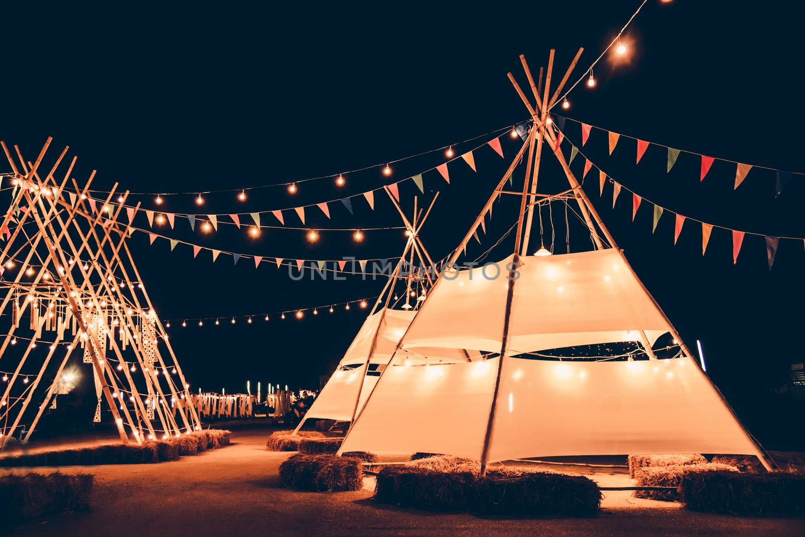 The marquee decorated with flags, decorated in a party during the night